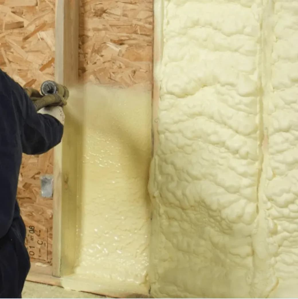 Closed-cell spray foam wall cavity Closed-cell spray foam being applied inside a framed wall cavity