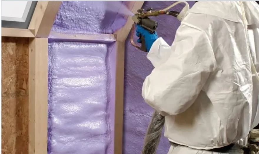 Closed-cell spray foam roofline Purple closed-cell spray foam being applied along a roofline
